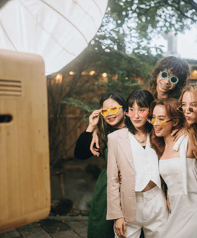 Friends posing with quirky sunglasses