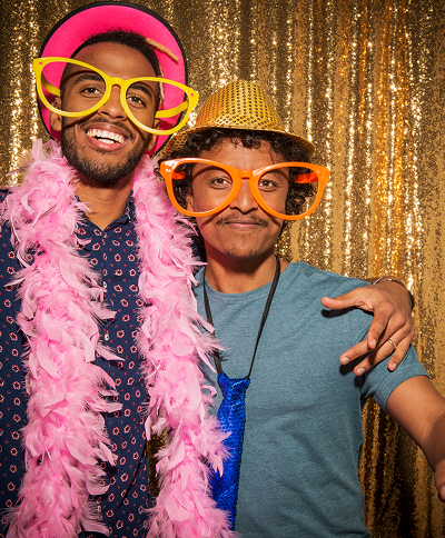 Happy friends posing in silly outfits