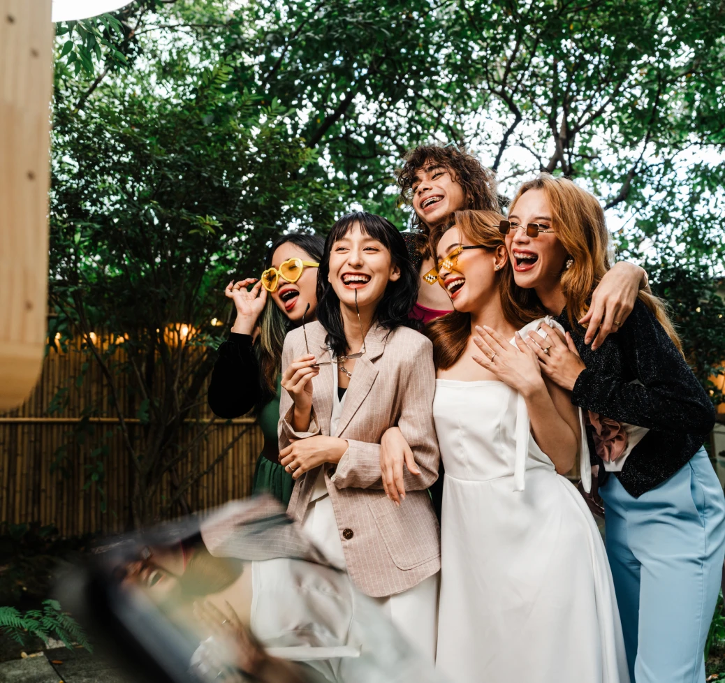 Friends wearing sunglasses laughing together